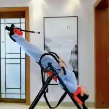 Inversion table device for spinal traction64171288064771110