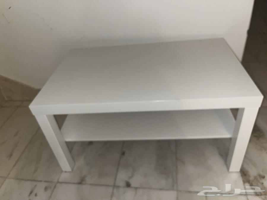 Two white IKEA tables and two TVs64203975102722111