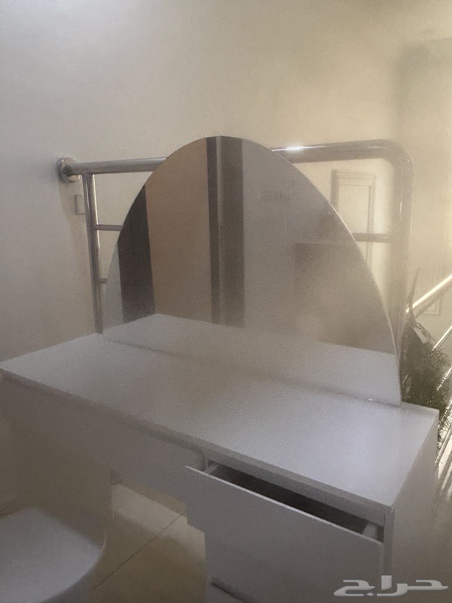 A small setup with a TV table that has slight scratches as shown in the photo64243691967618111