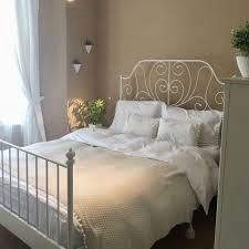 Two IKEA single and a half beds, white color, very clean64235635753986111