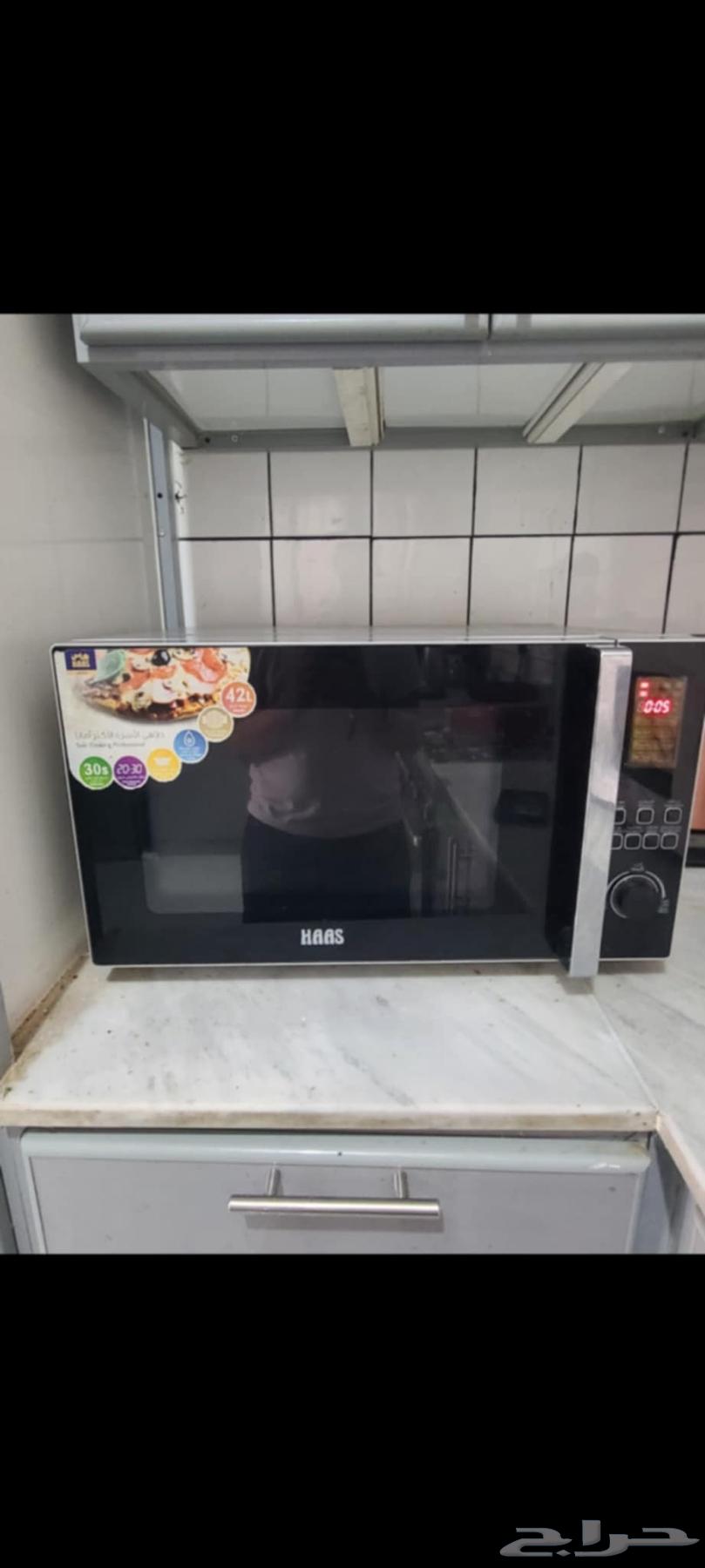 Large microwave, baby items, PlayStation, and household items64245481549314110