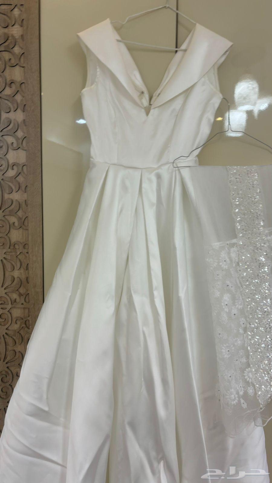 فستان زواج ساده كلاسيك من تصميم المصممة ام طلال64265604982529114
