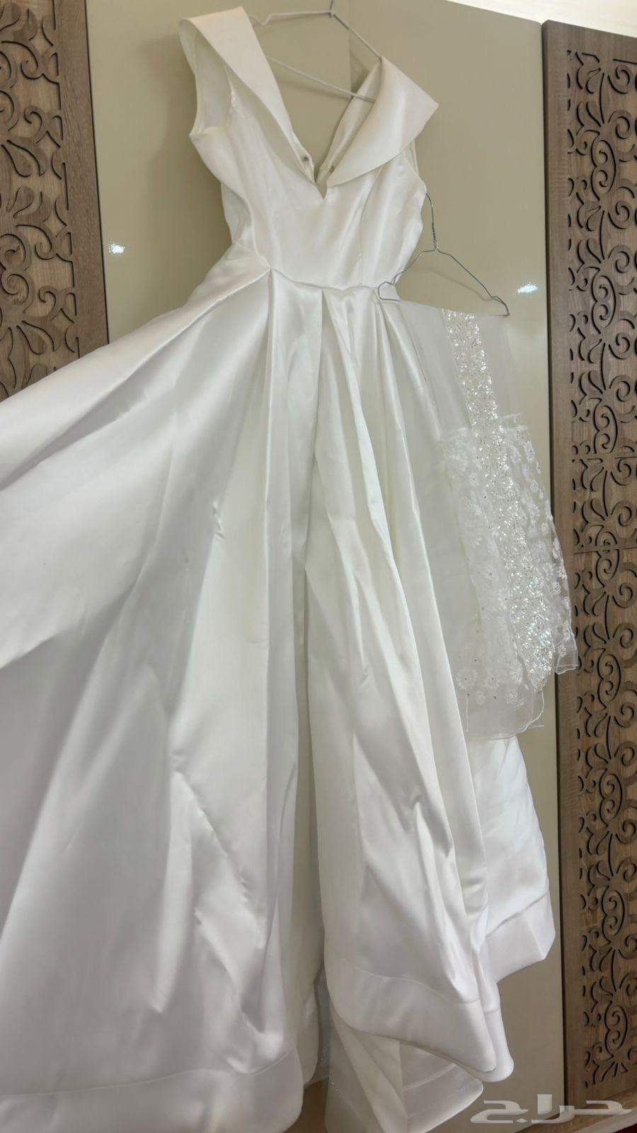 فستان زواج ساده كلاسيك من تصميم المصممة ام طلال64265604982529110