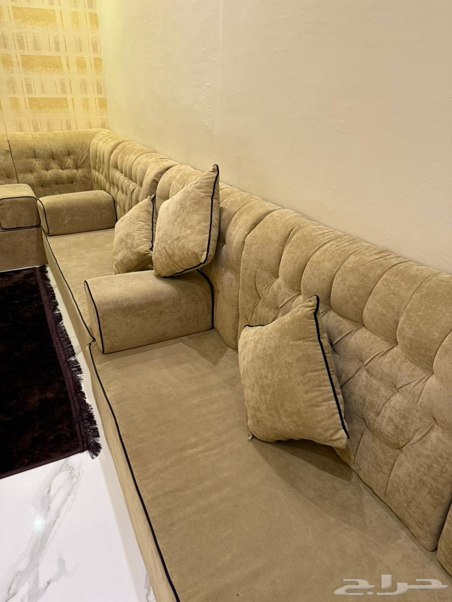 Corner sofa set with chandelier, coffee table, and four chairs priced at 50064330684518275111