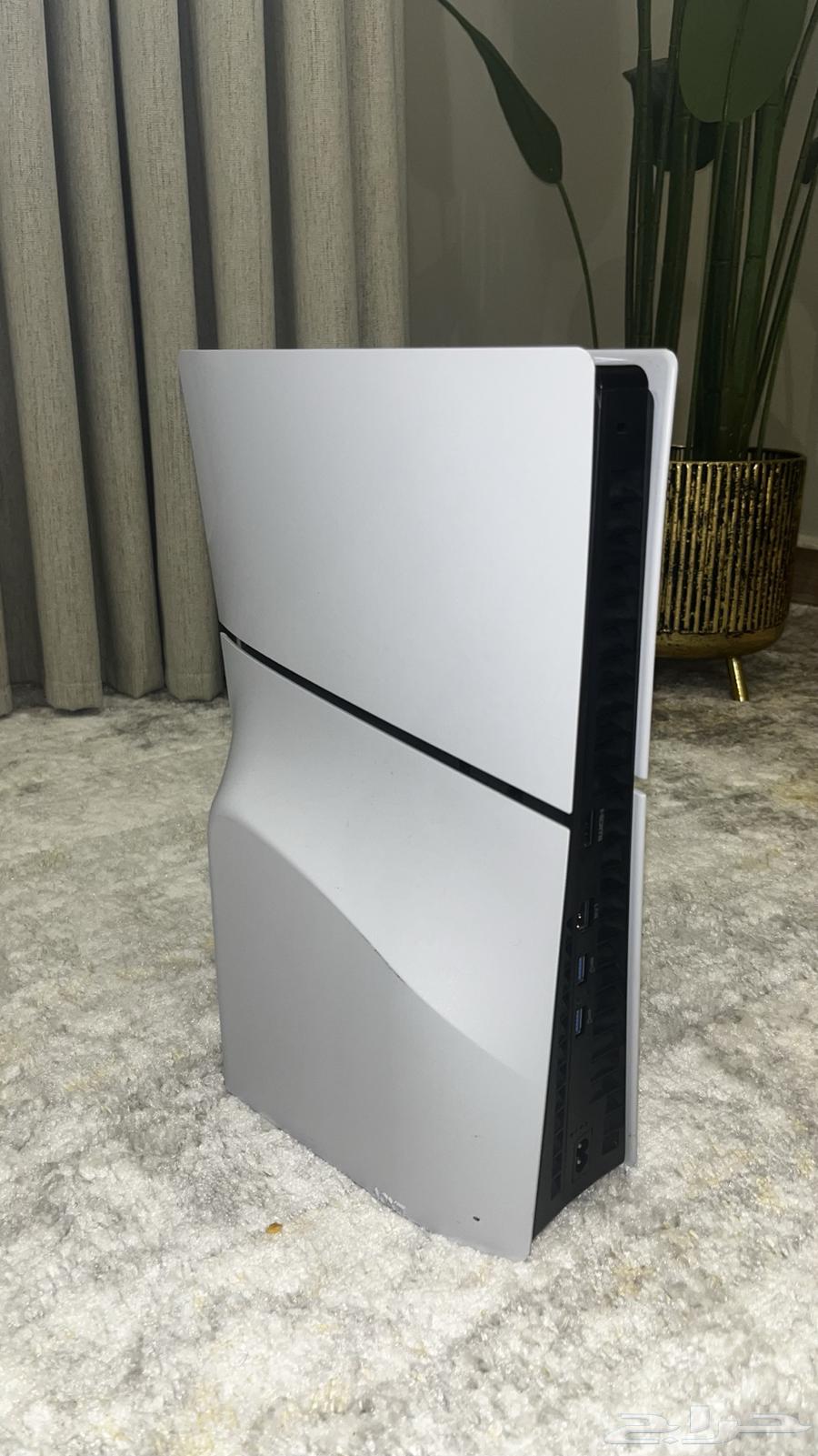 Sony 5 Slim with its cable and controller.64342171410691112