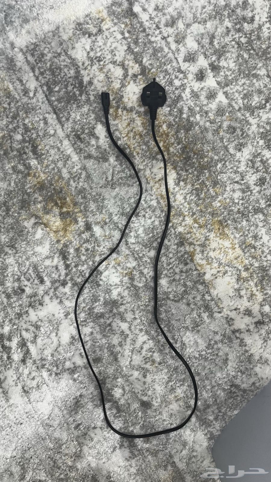 Sony 5 Slim with its cable and controller.64342171410691114