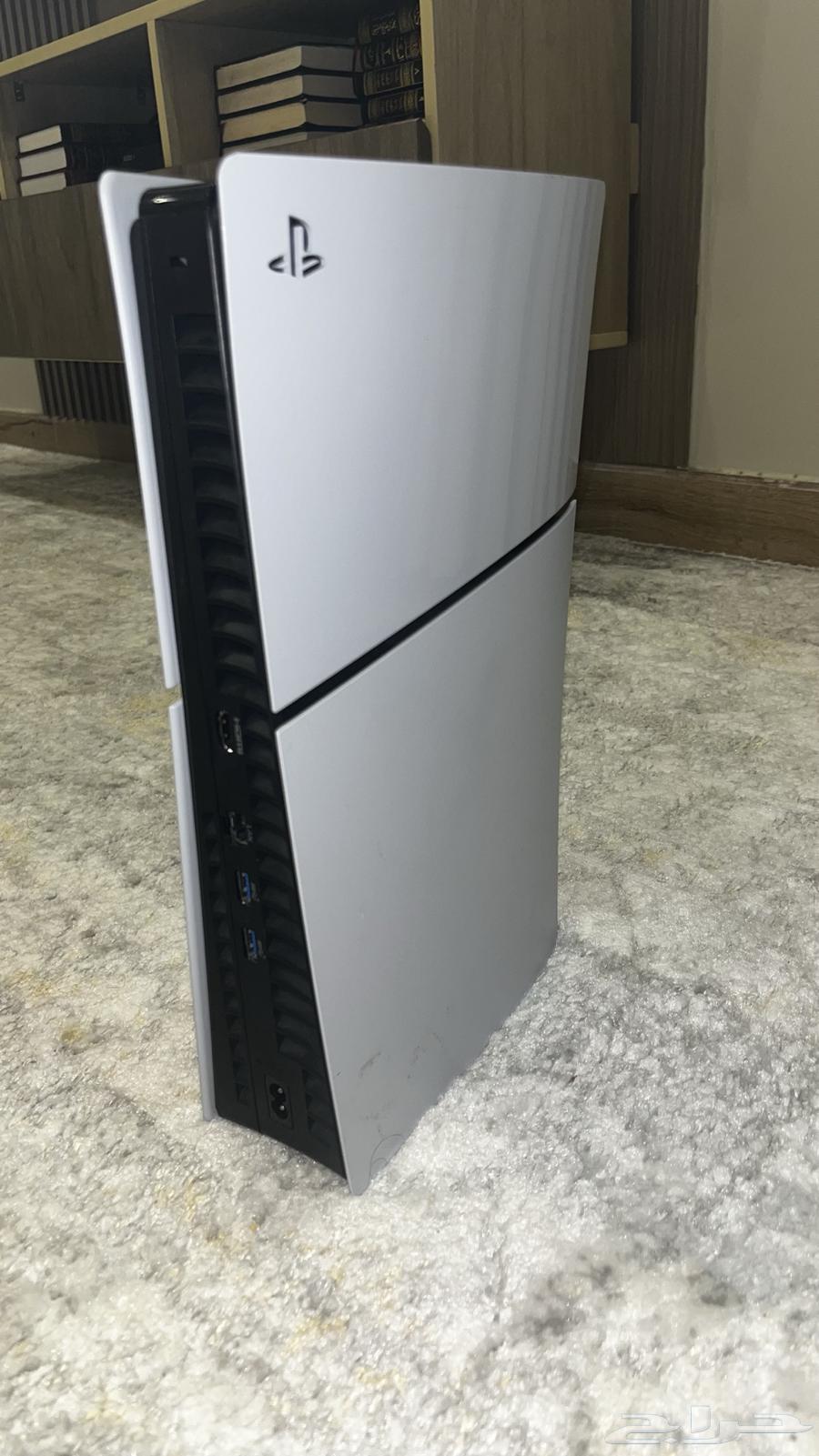 Sony 5 Slim with its cable and controller.64342171410691111