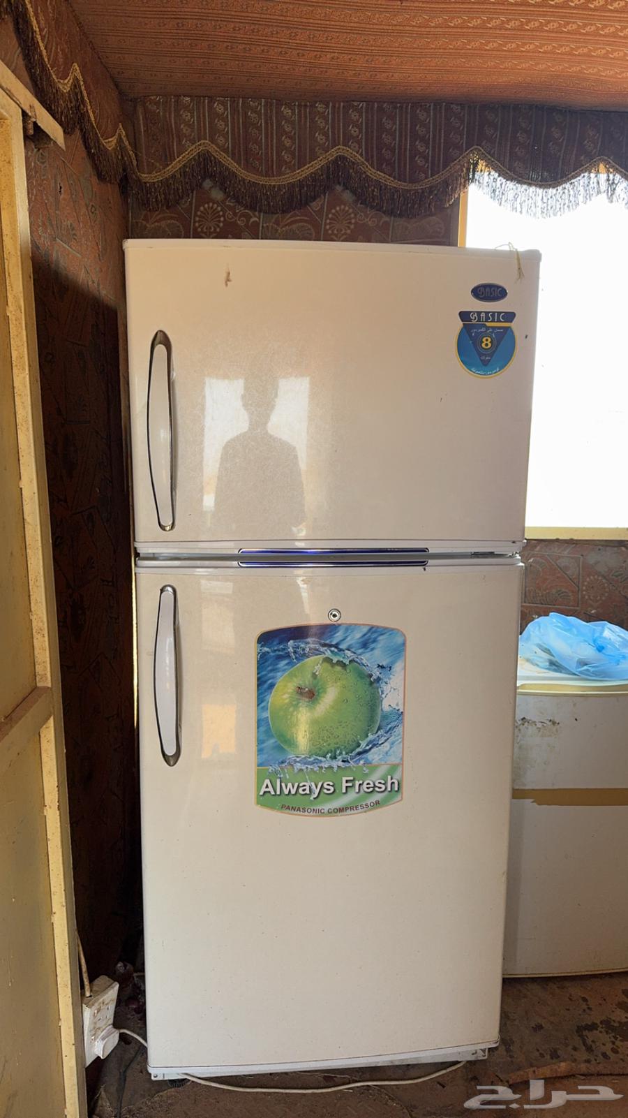 A new and large refrigerator, reason for sale is that a refrigerator has been purchased64351851734147110