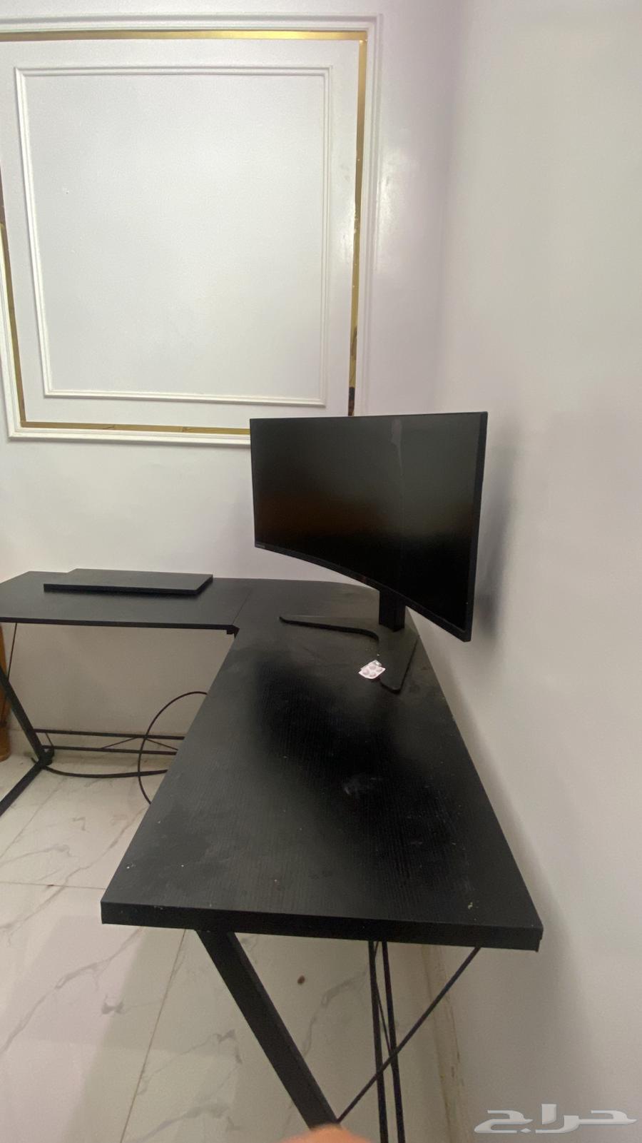 A gaming table that supports two monitors and a PC64374905725571110