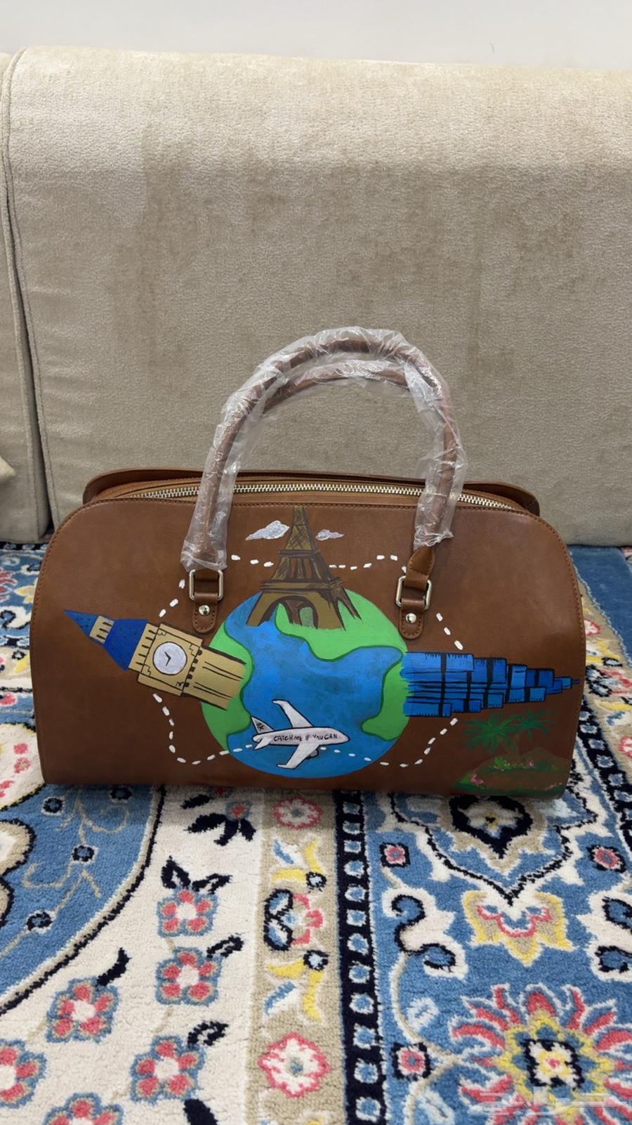 شنطة جلدية Chaos Riyadh مرسومة يدوي ا64383830235778112