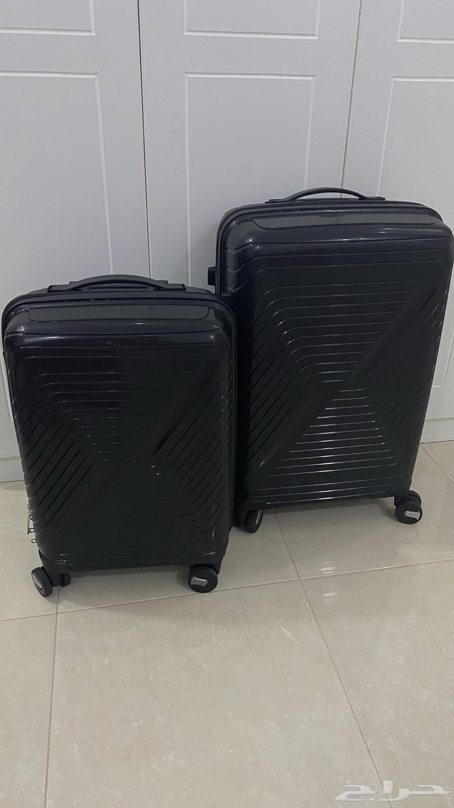 شنط سفر سودا جديدة64383664087170110