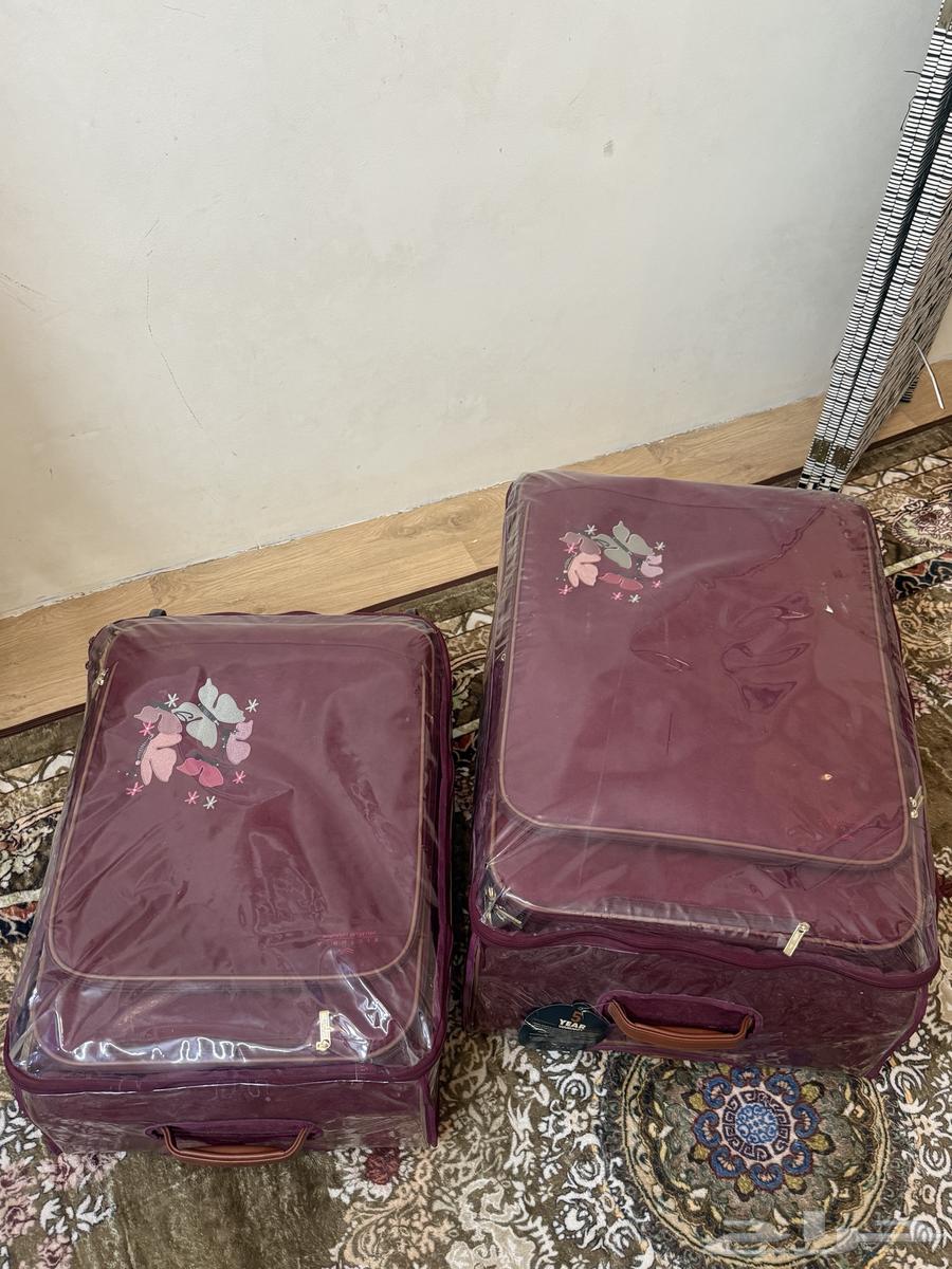 شنطة سفر 2 قطع عنابي64373311976323111