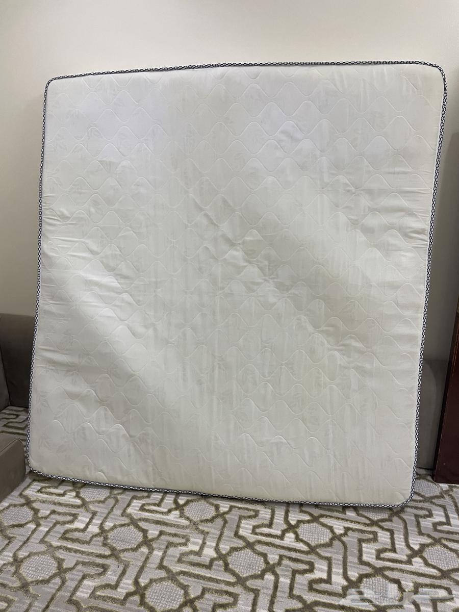 Sofa with angel, rug, table, and newly furnished room64386710830977114