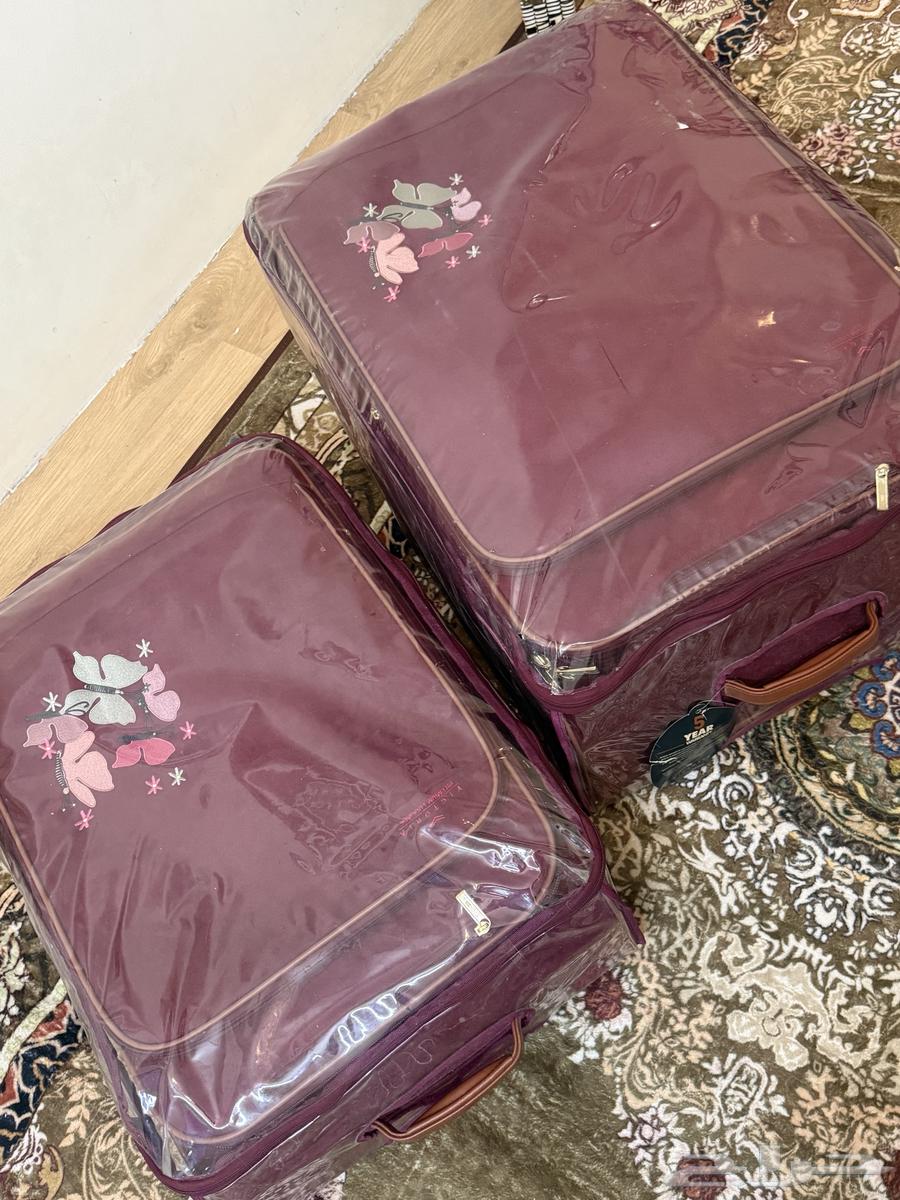 شنطة سفر 2 قطع عنابي64373311976323112