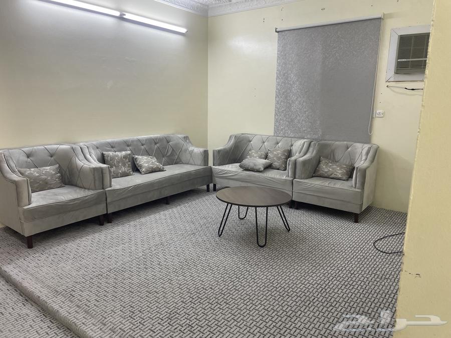 Sofa with angel, rug, table, and newly furnished room64386710830977112