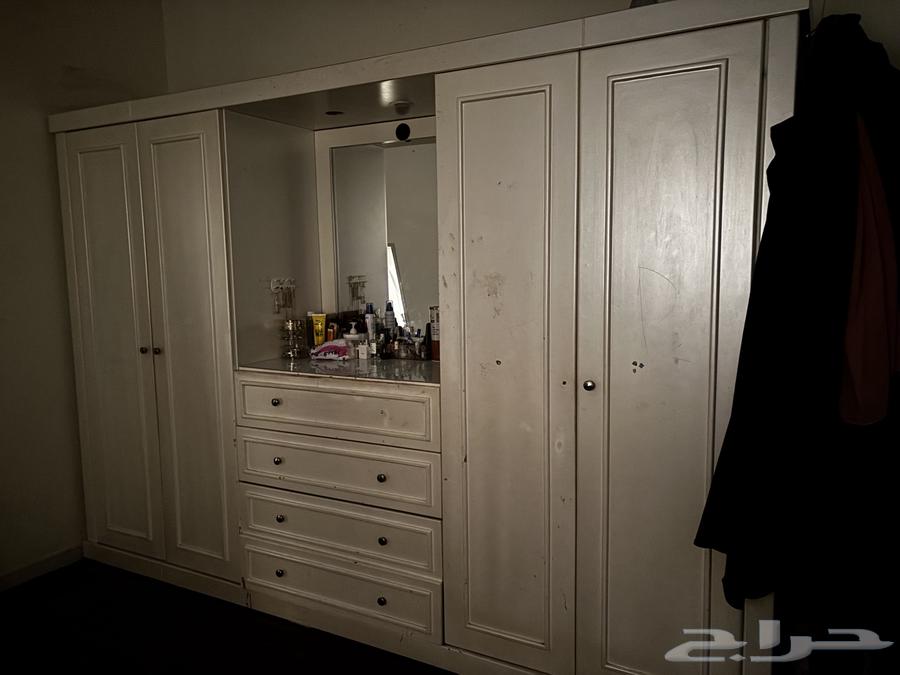 Complete room with dressing table, wardrobe, two beds, and mirror64382279155970110