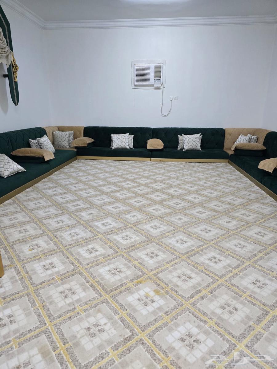 Green and beige used floor seating set, 4 by 6 meters, with curtain and 7 golden tables that have some scratches, two of them need stitching and adjustments64400702505603114