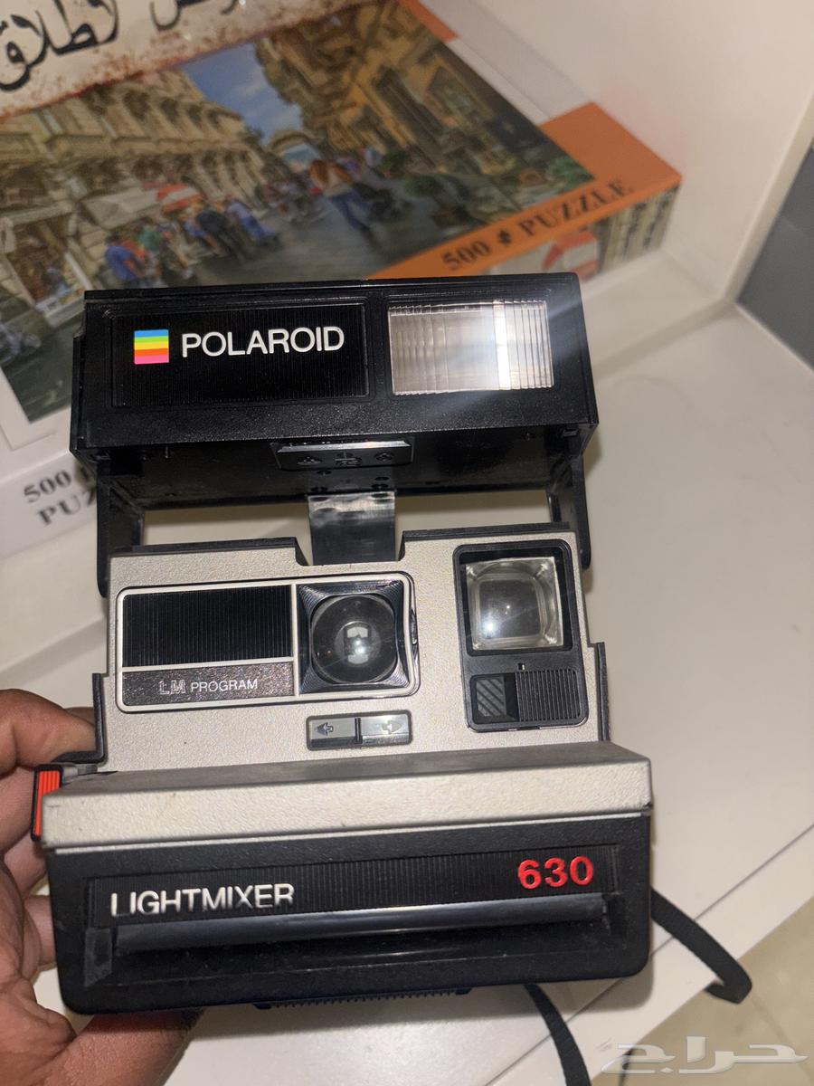 An old frame over 70 years old, Polaroid 630 camera64396505539585113