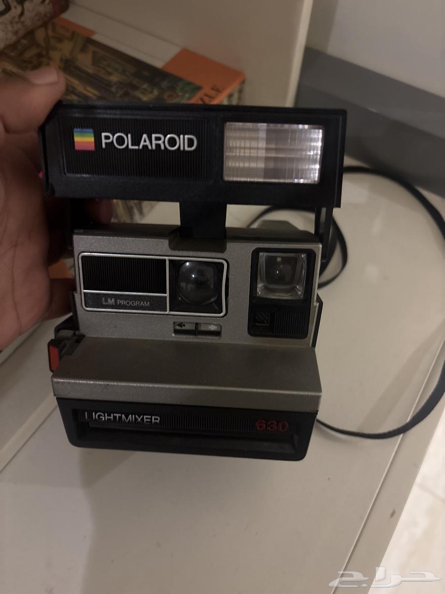 An old frame over 70 years old, Polaroid 630 camera64396505539585111