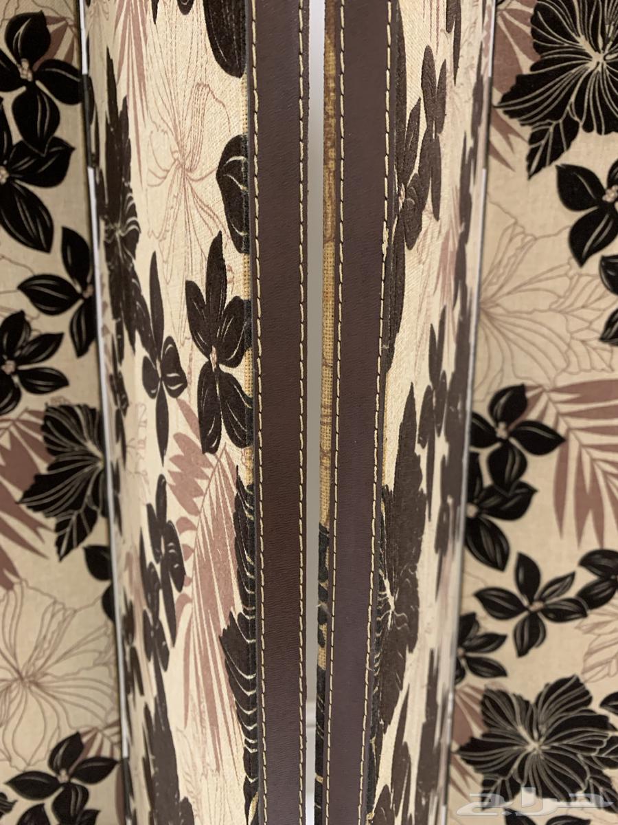 Double bed, wooden partition, and entrance table64397088241025113