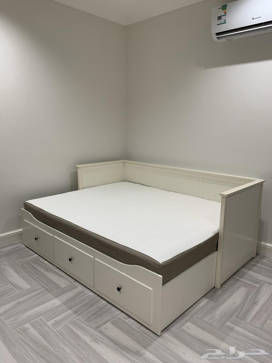 Double bed, wooden partition, and entrance table64397088241025110