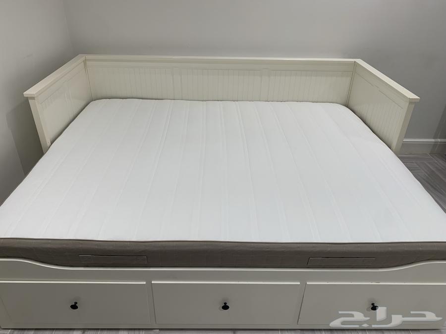 Double bed, wooden partition, and entrance table64397088241025111