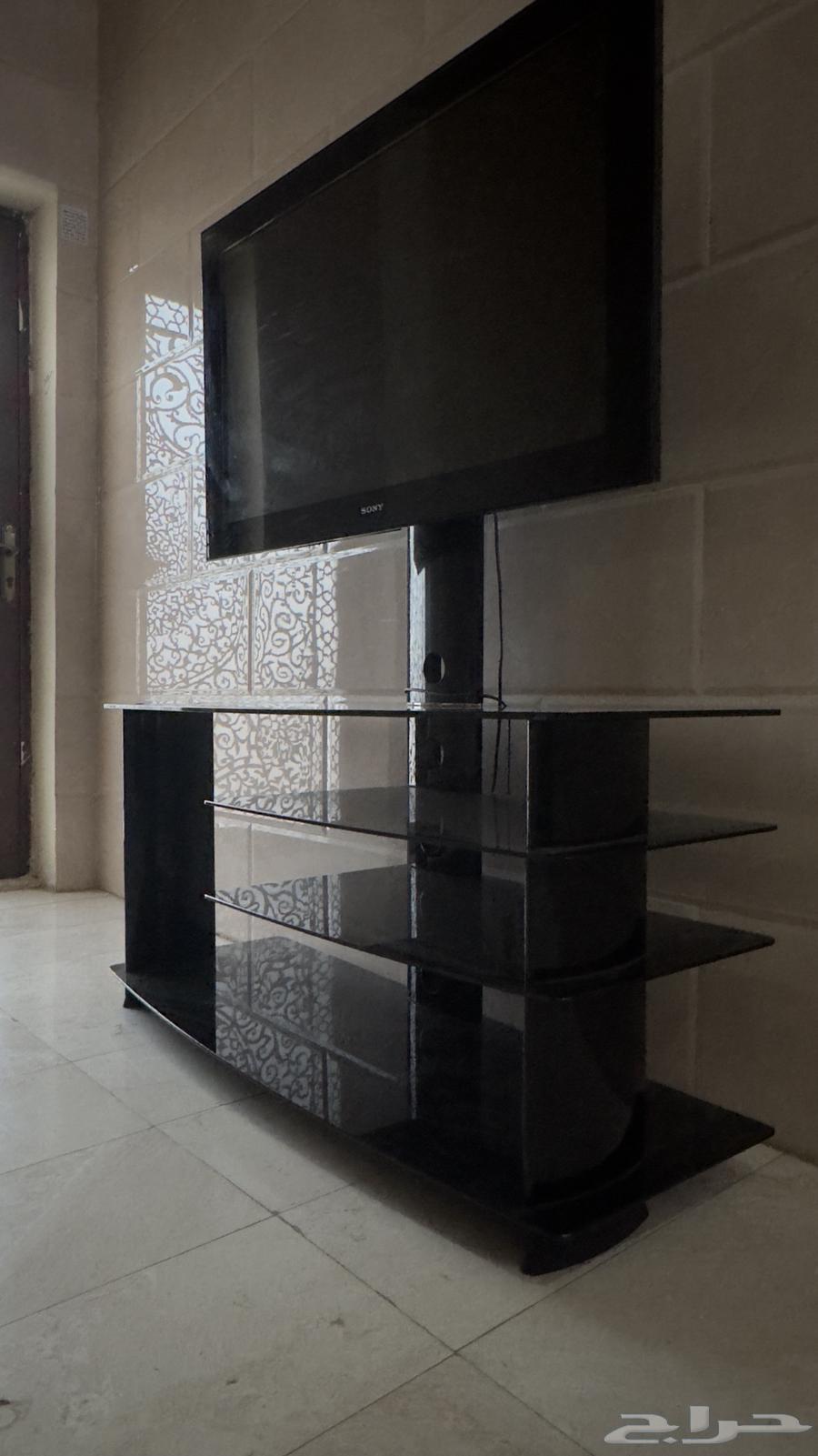 شاشة تلفزيون من سوني مع طاولة زجاجية64402692500482114