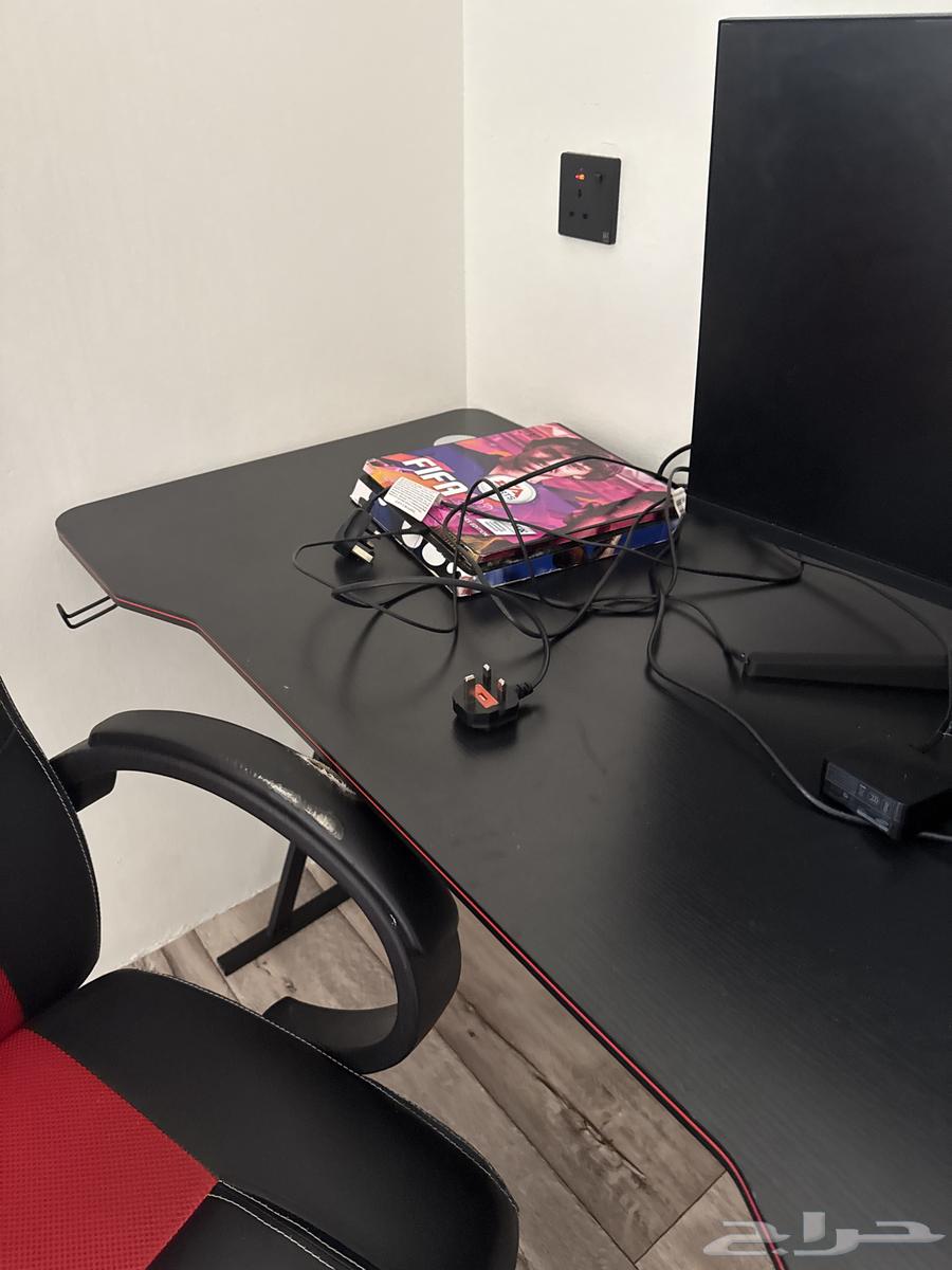 Sony PS5 console, mouse, keyboard, table, screen, controller, and chair63619566934657112
