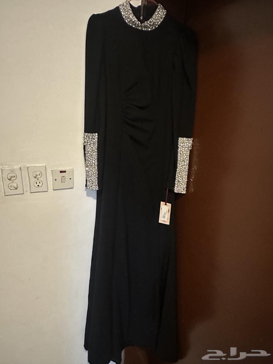 فستان اسود كلاسيكي مميز و جمبسوت ليلكي بأكمام منفوخة مميزة64415343829890110