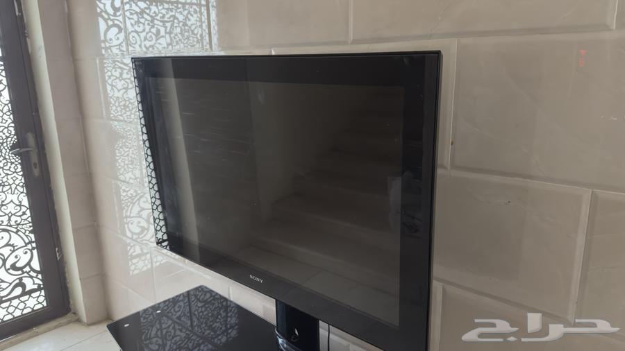 شاشة تلفزيون من سوني مع طاولة زجاجية64402692500482112