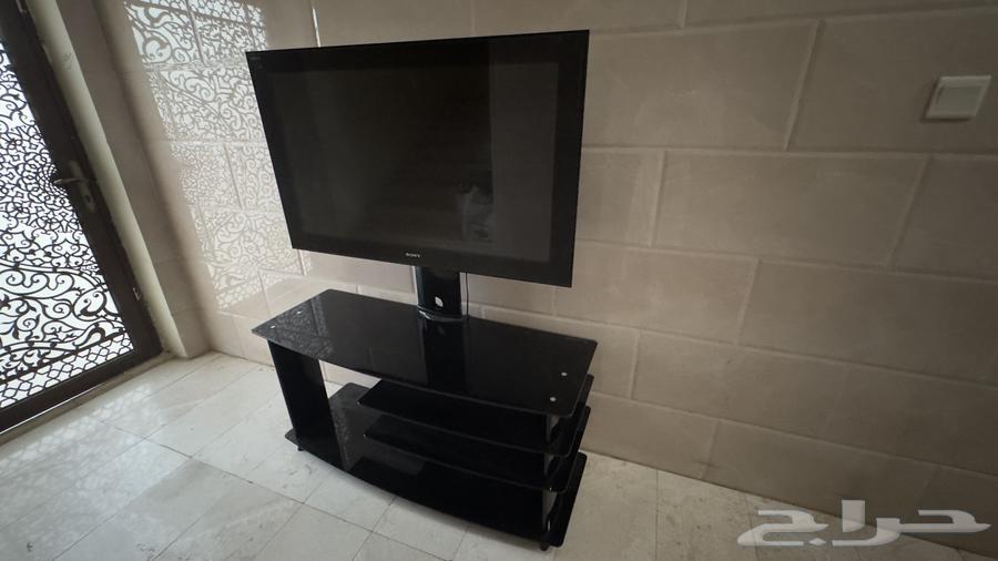 شاشة تلفزيون من سوني مع طاولة زجاجية64402692500482110
