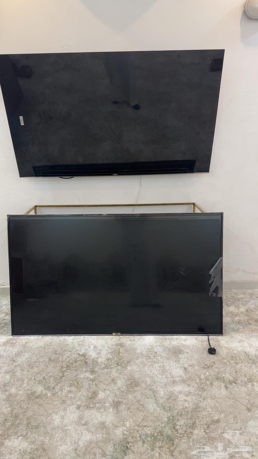 2 KMC TVs 65 inches with broken screens due to a minor resolution issue that isn't clear64411715053313113