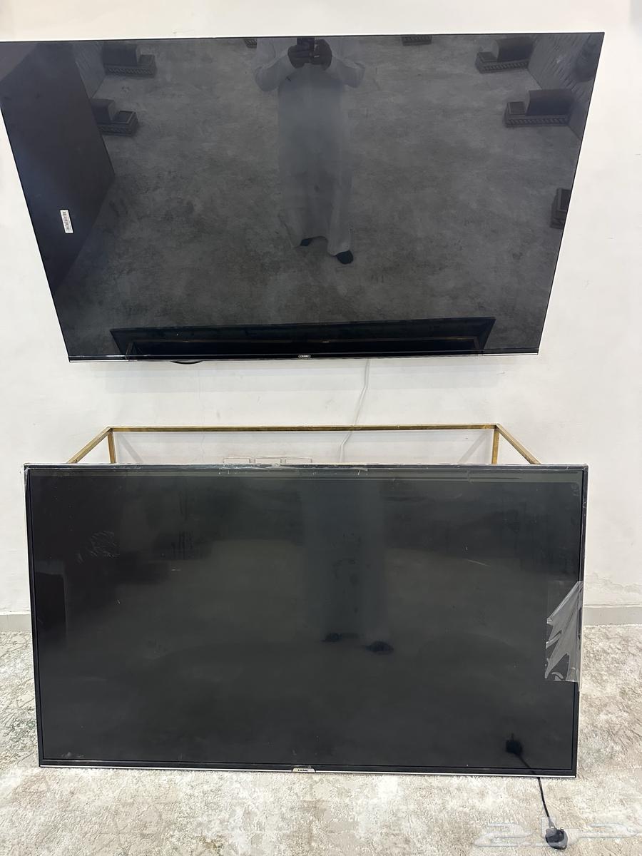 2 KMC TVs 65 inches with broken screens due to a minor resolution issue that isn't clear64411715053313111