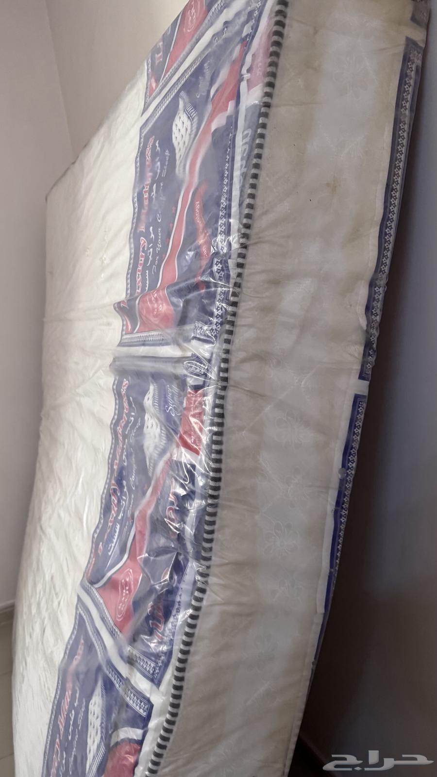 Bed with a new unused mattress64419238394113113