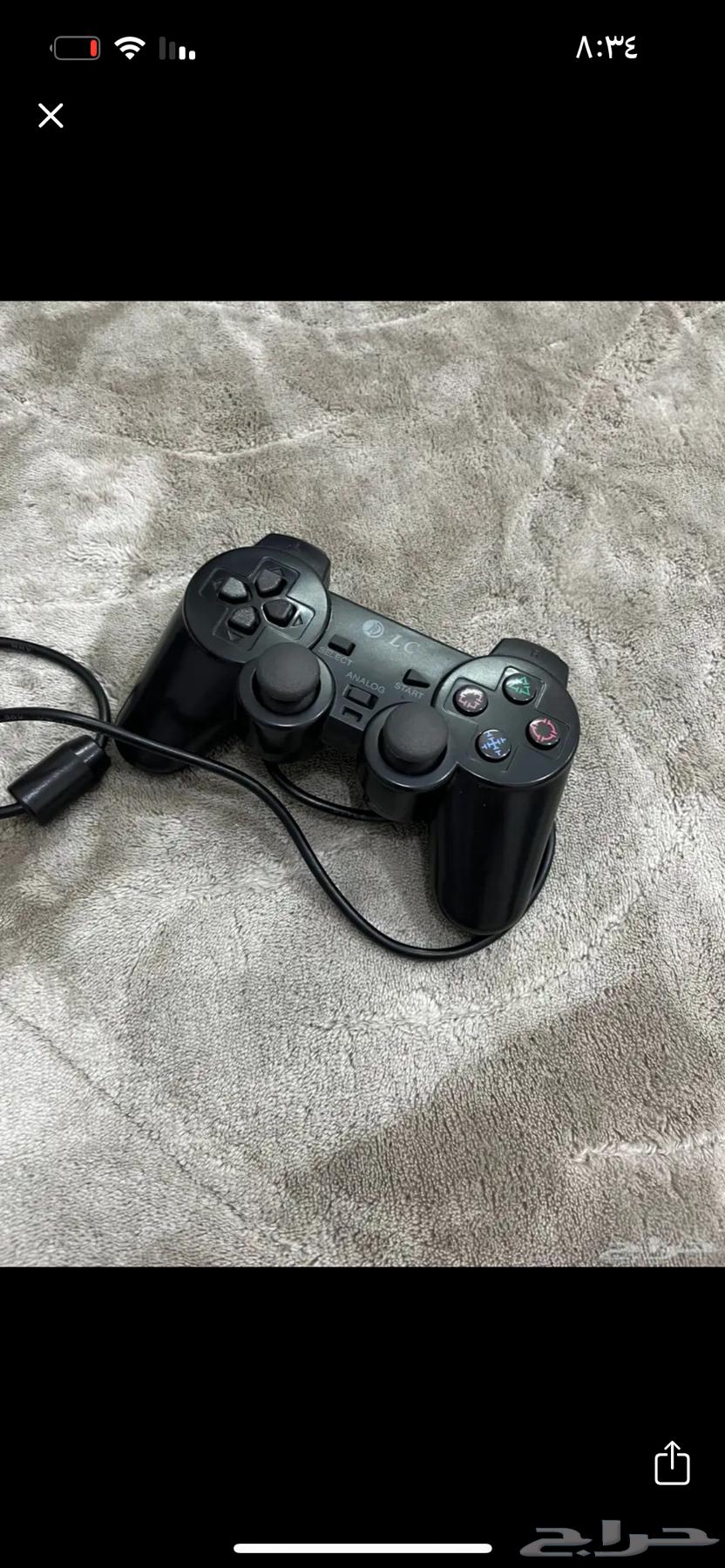 Sony 2 with its controller and cables64423462603267113