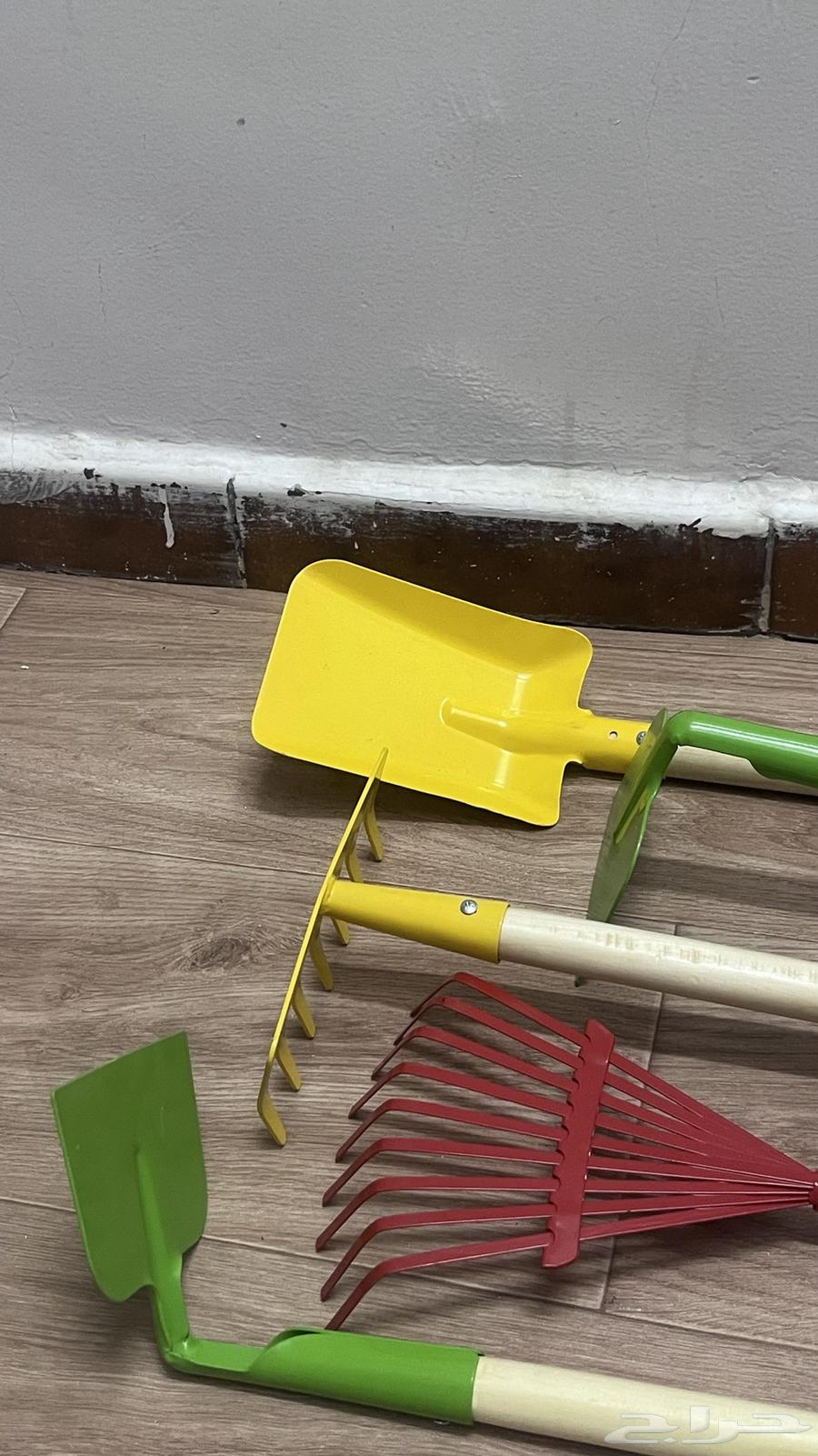 Agricultural tools for sale: rake, comb, and hoe.64441911022850110