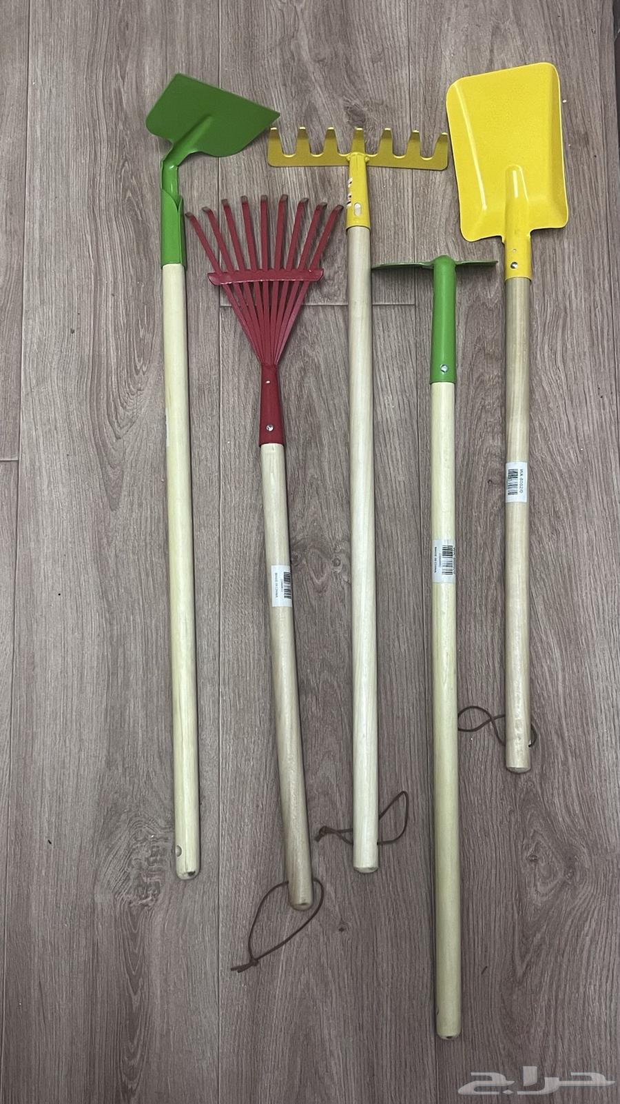 Agricultural tools for sale: rake, comb, and hoe.64441911022850111