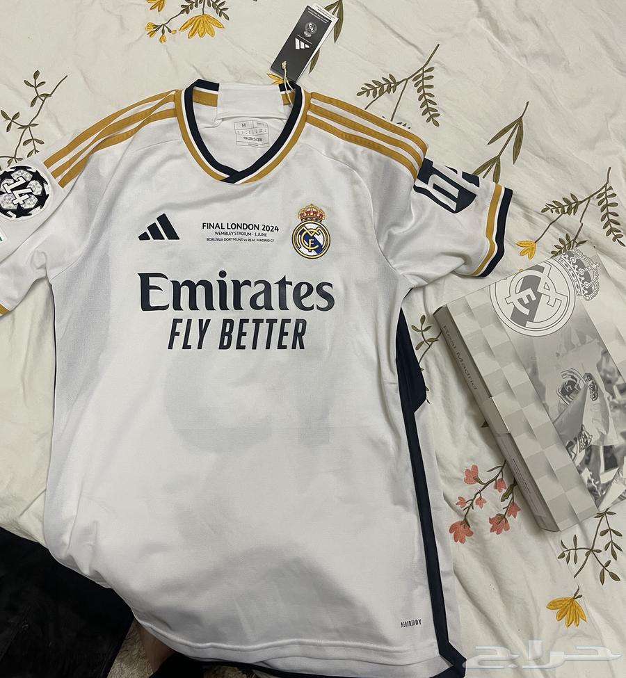 قميص ريال مدريد الرسمي مع شارة ورقم دوري أبطال أوروبا64434741237506110