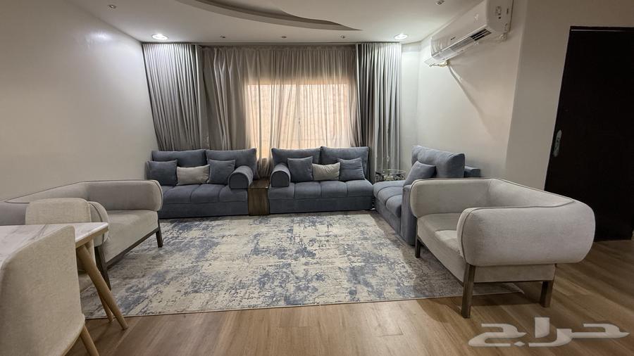 A living room set consisting of a sofa, carpet, star lights, and Wi-Fi64445255825281110