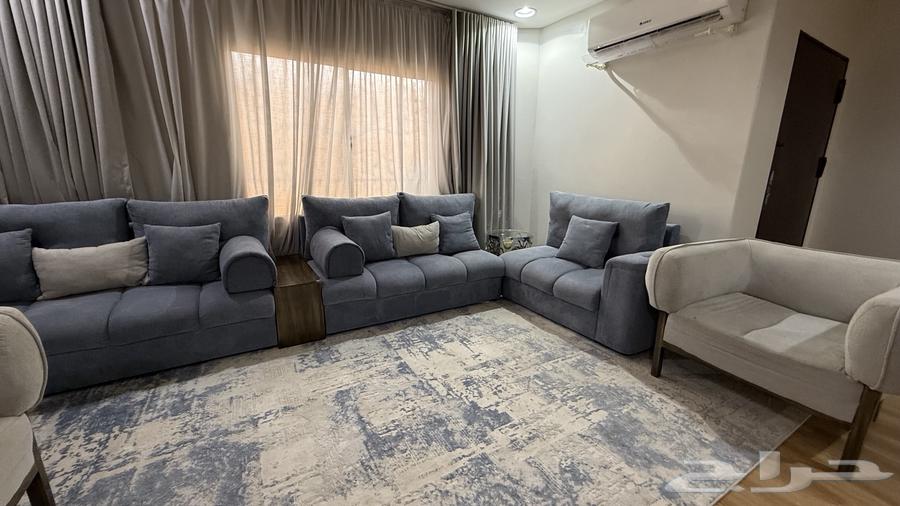 A living room set consisting of a sofa, carpet, star lights, and Wi-Fi64445255825281111