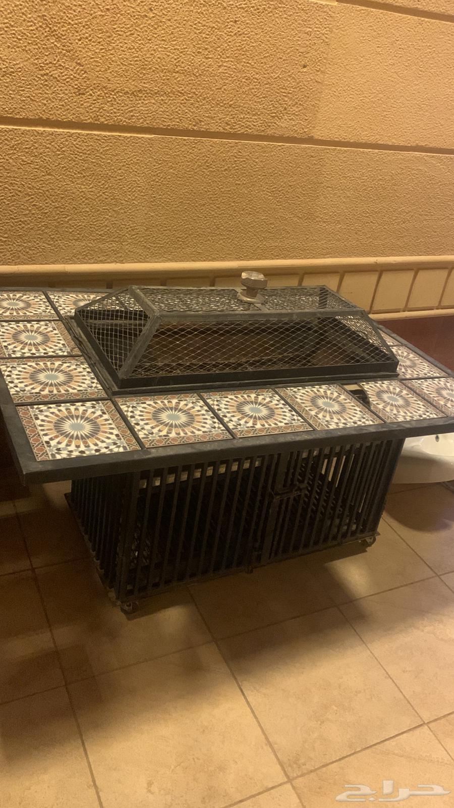 New TV stand and large wood and charcoal burner, almost new, new heater64453339117954111