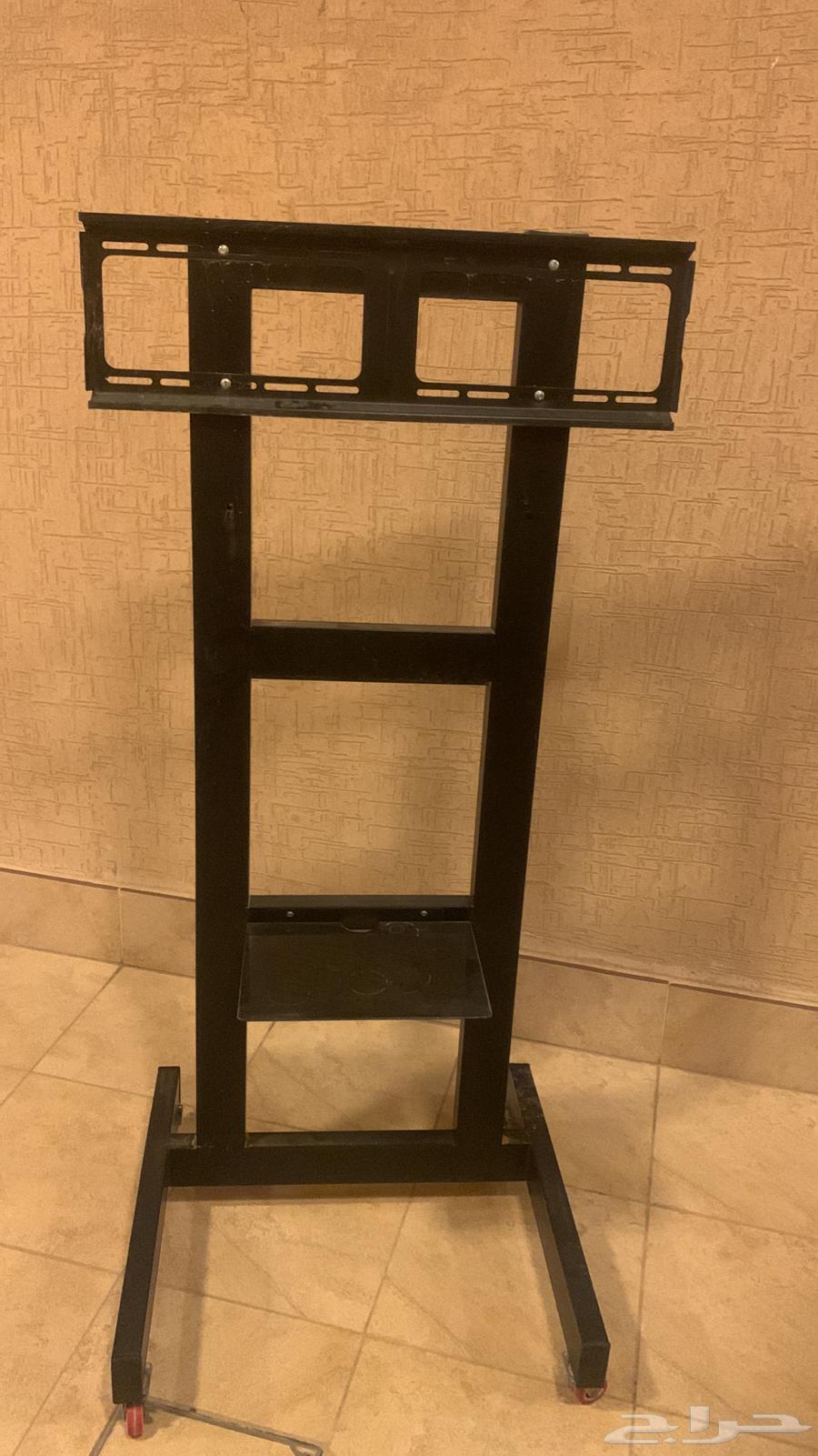 New TV stand and large wood and charcoal burner, almost new, new heater64453339117954110