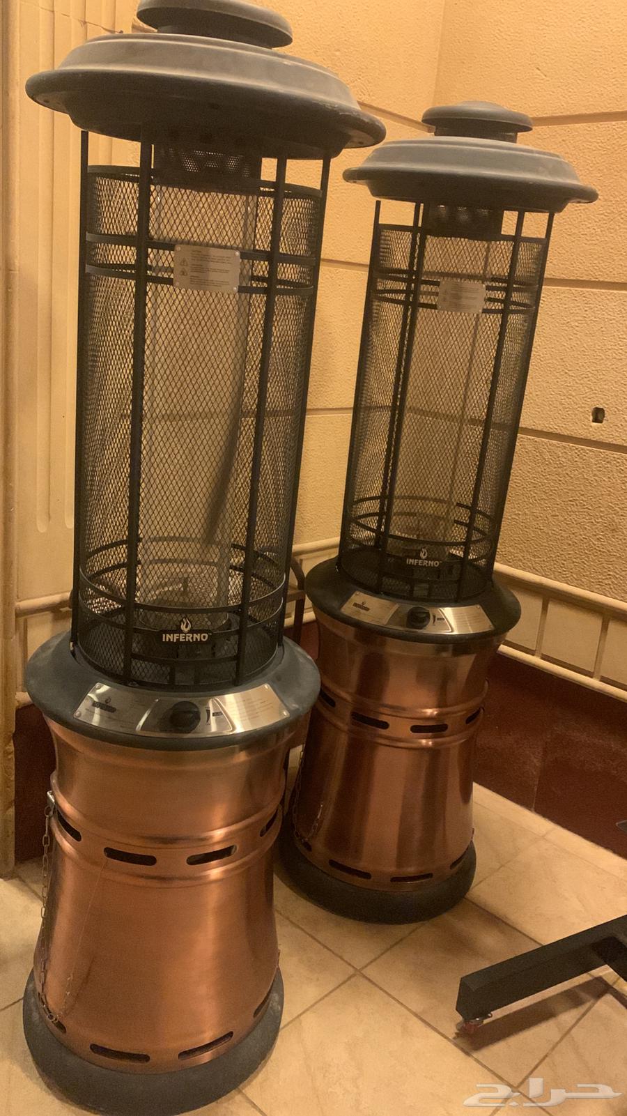 New TV stand and large wood and charcoal burner, almost new, new heater64453339117954113