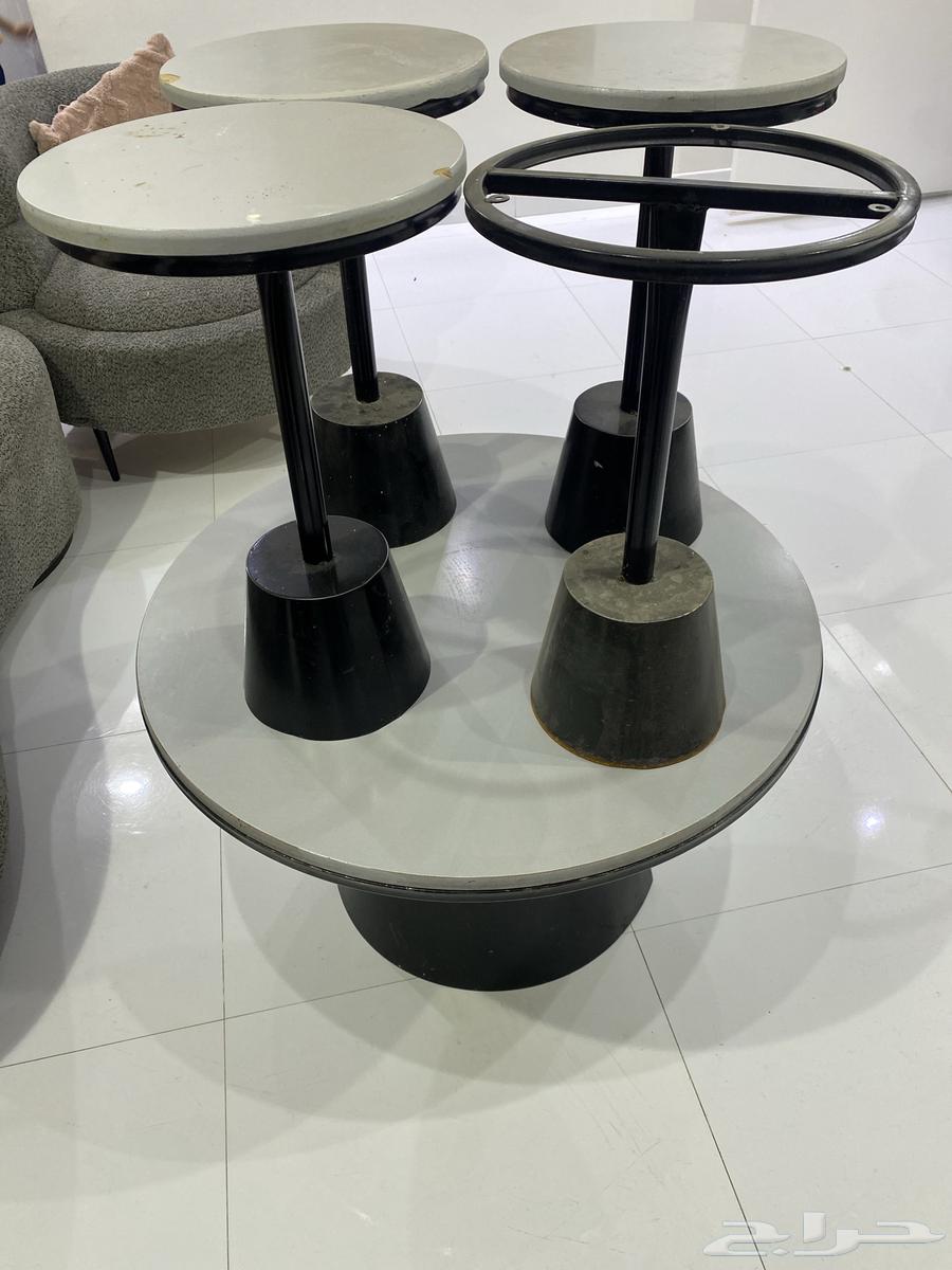 L-shaped sofa and iron table with three services, one of which has wood on top64456639904514110