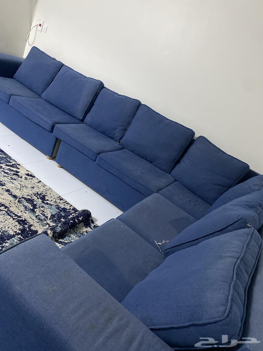 L-shaped sofa and iron table with three services, one of which has wood on top64456639904514112