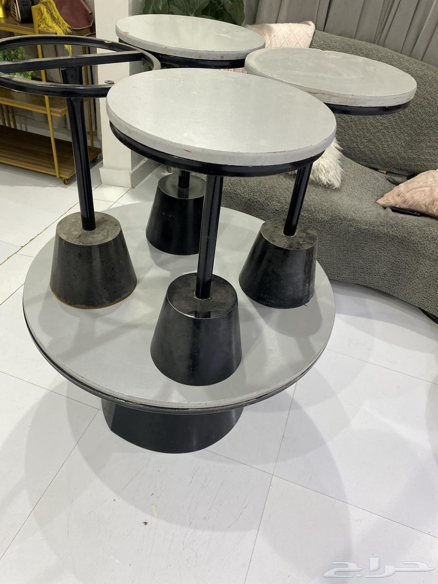 L-shaped sofa and iron table with three services, one of which has wood on top64456639904514111