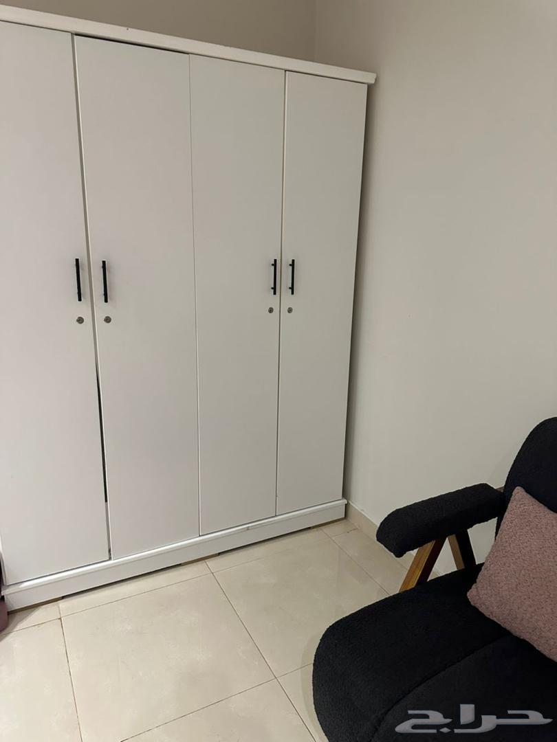 Double bed, wardrobe, and L-shaped chairs64463944772865111