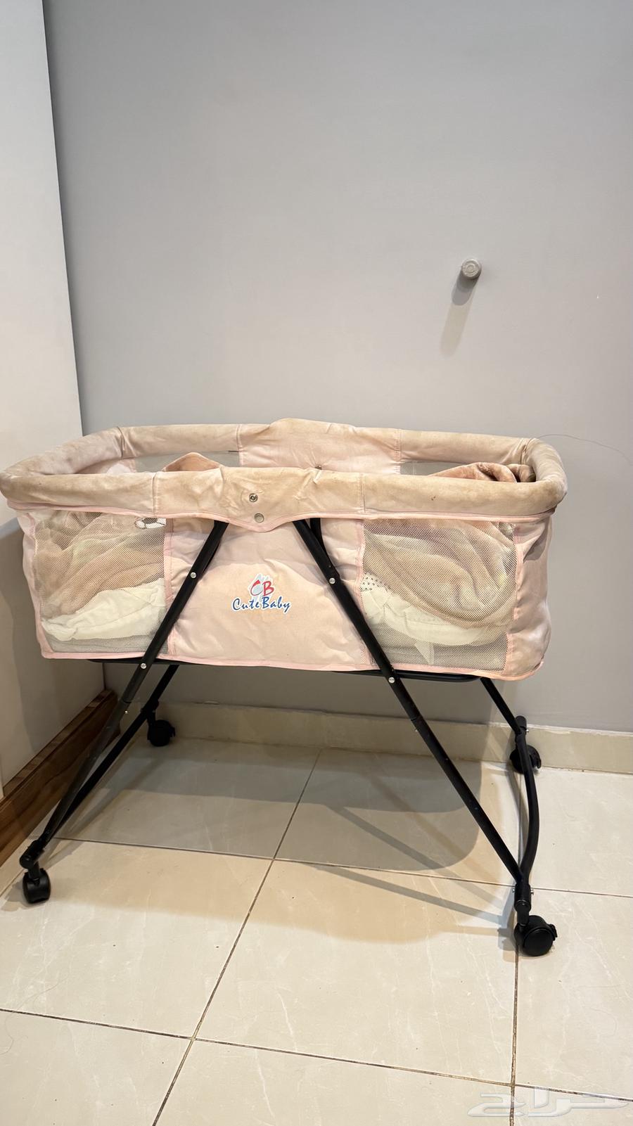 Clean bed and a baby chair shaped like a stroller, clean64468092884226110