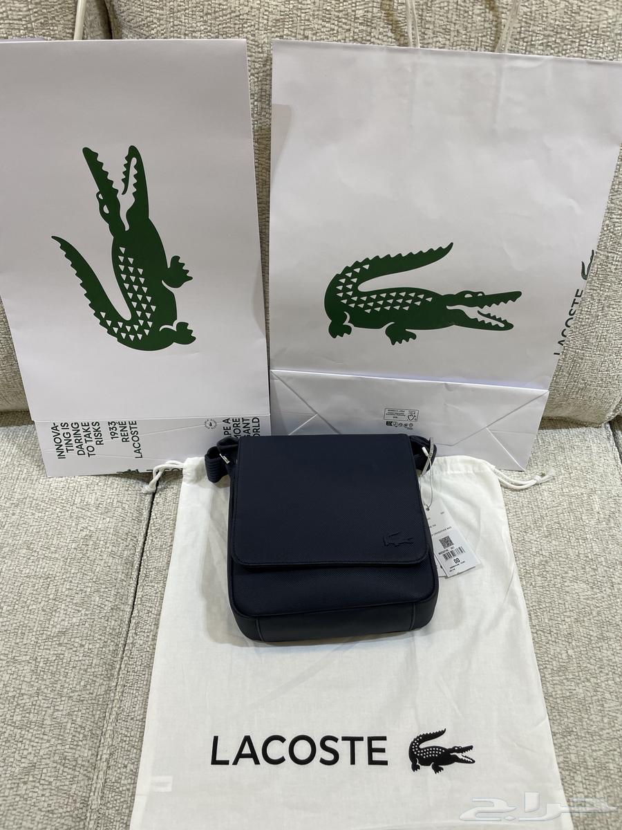 شنطة لاكوست اصلية جديدة مع كيس الوكيل64467536069122111