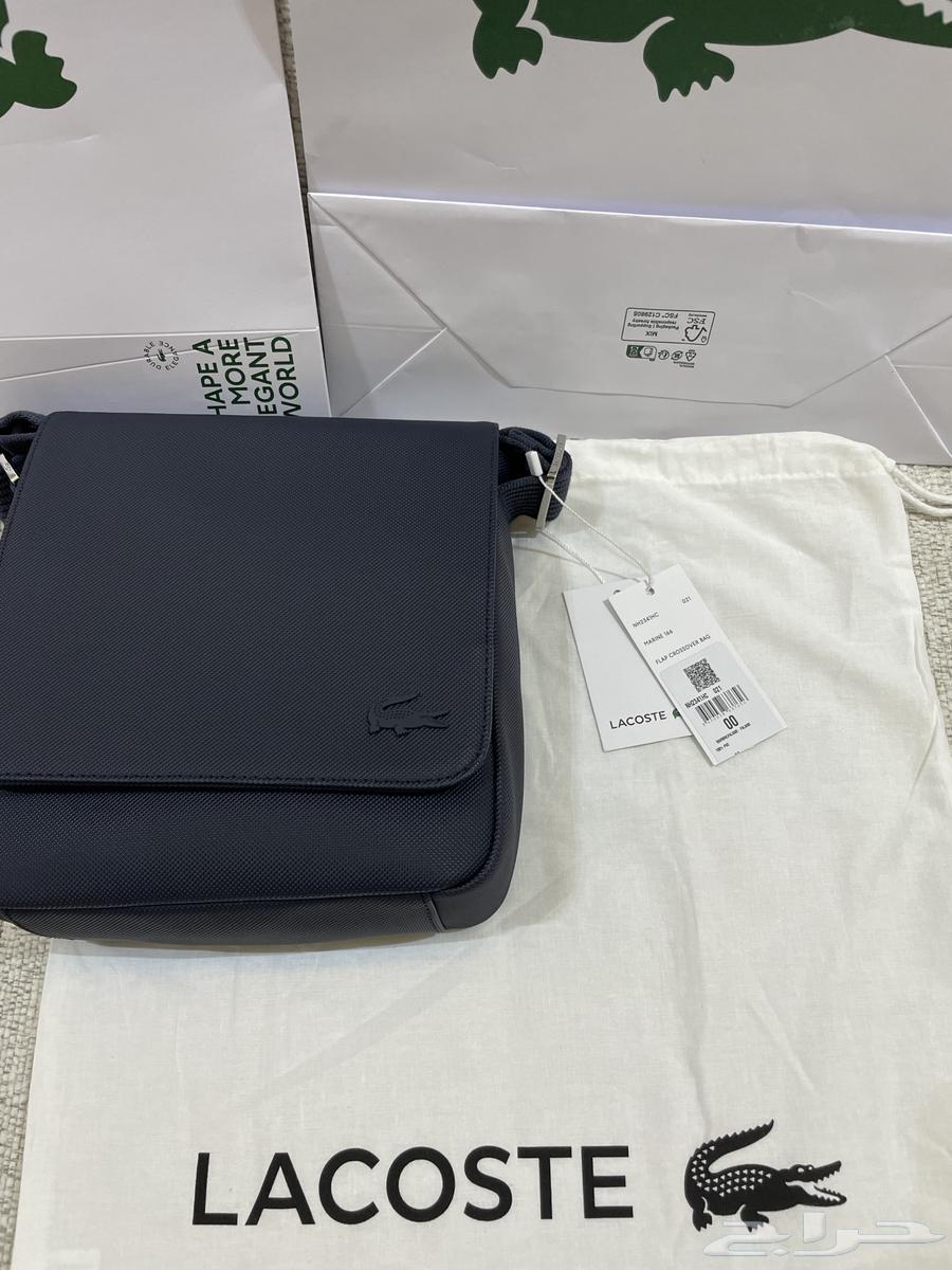 شنطة لاكوست اصلية جديدة مع كيس الوكيل64467536069122112
